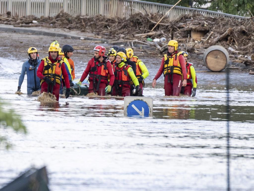 Rescue workers retrieve a body from floodwaters in the town of Trebes, southern France. Picture: AP