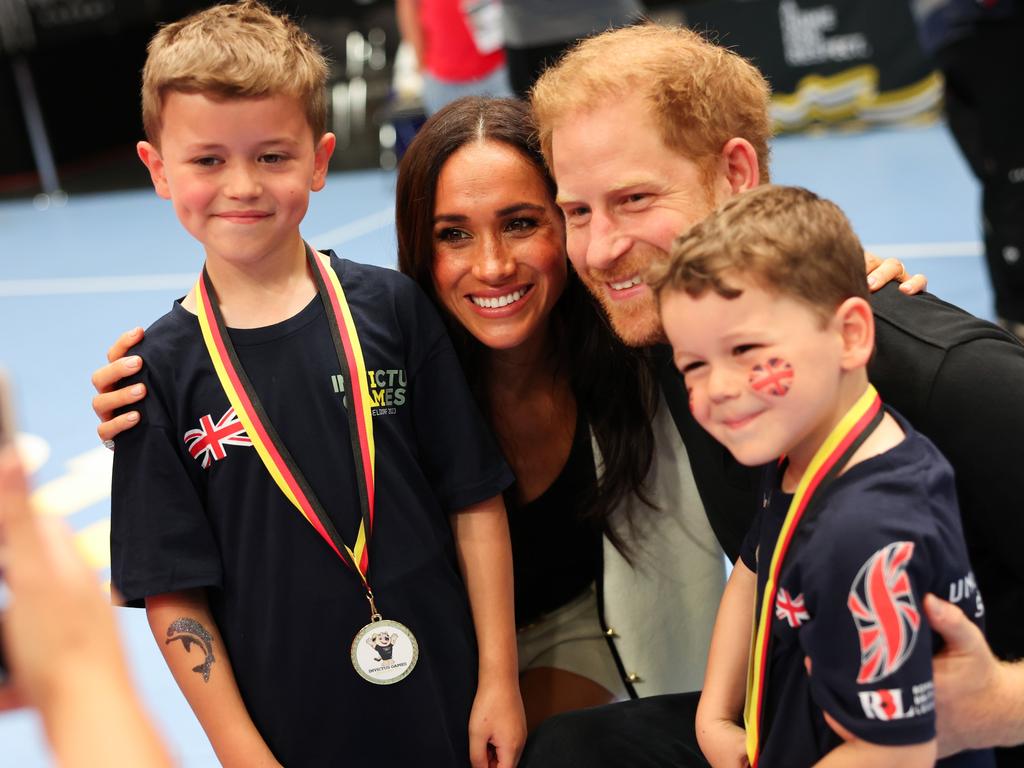 The couple shared a cute moment with some kids during the event. Picture: Chris Jackson/Getty Images