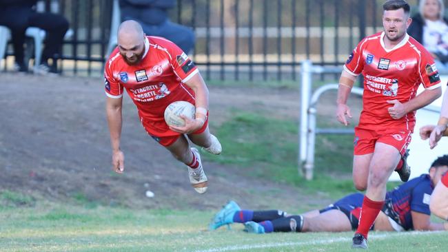 Superman: A try bound Blake Clayton takes off for East Campbelltown Eagles. Picture: Steve Montgomery