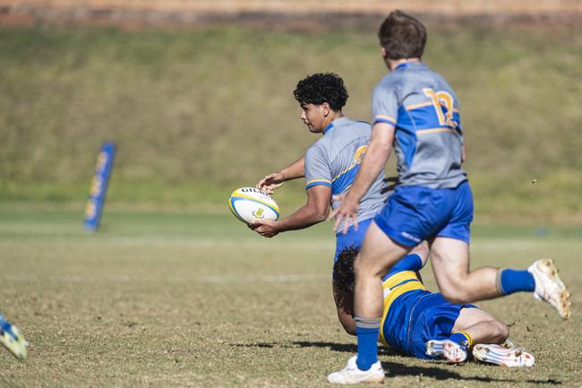 Harry Solofa gets away an offload for Churchie last season. Picture: Kevin Farmer