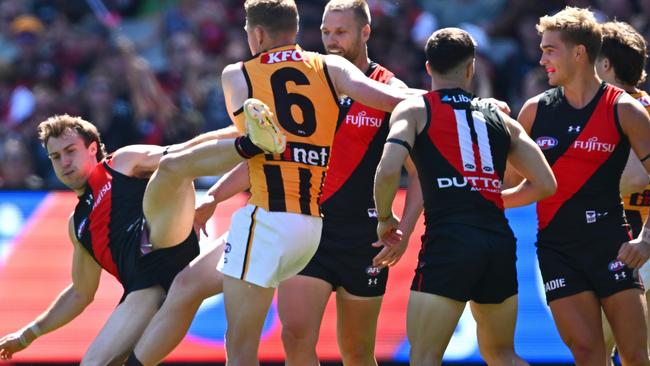 MELBOURNE, AUSTRALIA - MARCH 16: James Sicily of the Hawks gives away a free kick to Andrew McGrath of the Bombers during the round one AFL match between Essendon Bombers and Hawthorn Hawks at Melbourne Cricket Ground, on March 16, 2024, in Melbourne, Australia. (Photo by Quinn Rooney/Getty Images)