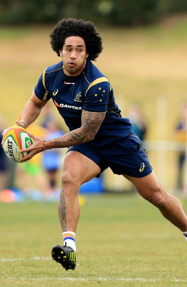 Joe Tomane stretches out during Wallabies training at a Bledisloe Cup camp in Dubbo.