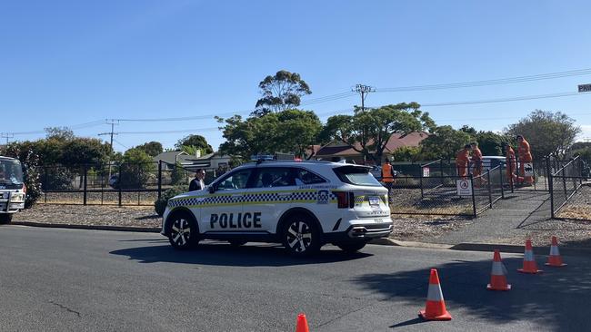 SA Police officers and State Emergency Service crews responding to an incident after a pedestrian was fatally struck by a train. Picture: Agnes Gichuhi