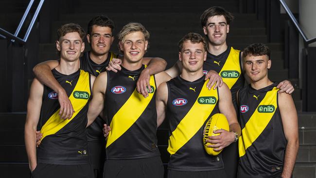 MELBOURNE, AUSTRALIA - NOVEMBER 21: Richmond draftees (L-R) Luke Trainor, Harry Armstrong, Josh Smillie, Sam Lalor, Jonty Faull and Taj Hotton pose for a photograph during the 2024 AFL Draft at Marvel Stadium on November 21, 2024 in Melbourne, Australia. (Photo by Daniel Pockett/AFL Photos via Getty Images)