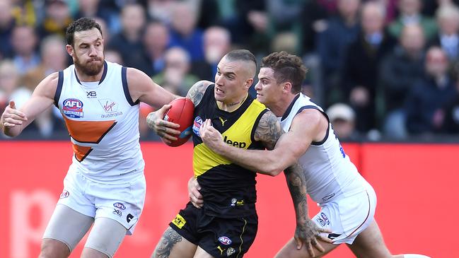 Heath Shaw attempts to tackle Dustin Martin during the grand final. Picture: Quinn Rooney/Getty Images.