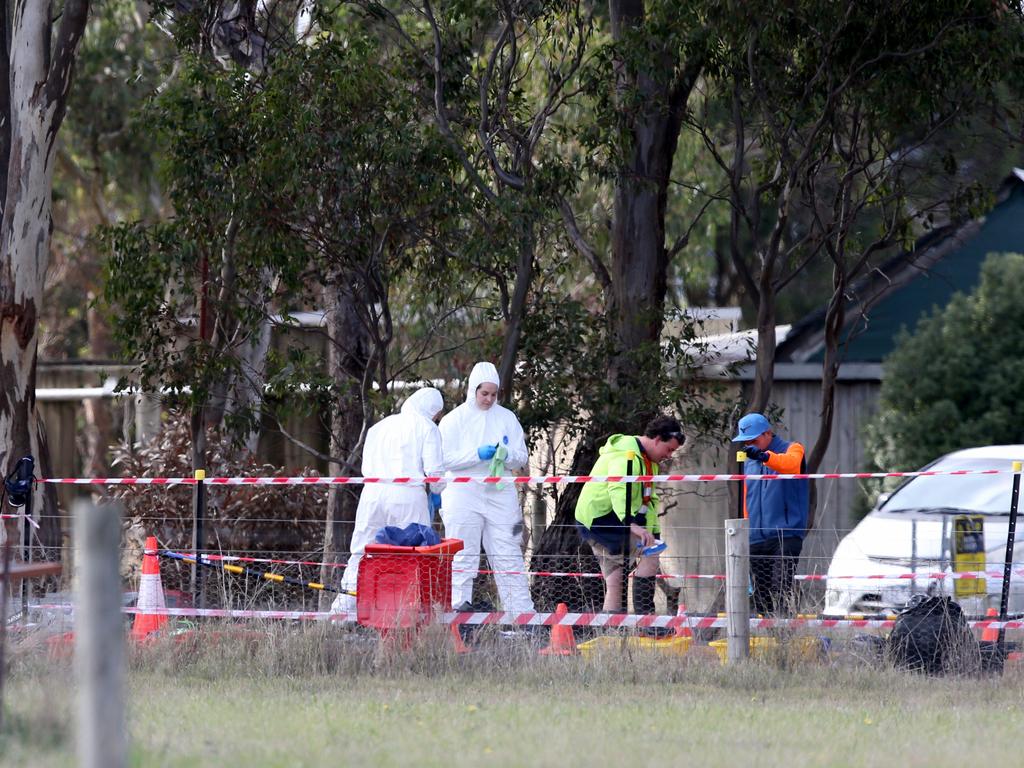 Workers in Victoria’s Meredith go through a cleaning station before entering the affected farm. Picture: Mike Dugdale