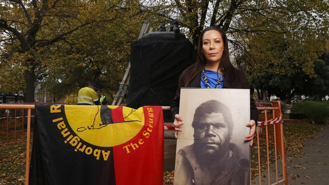 Nala Mansell with a picture of palawa man William Lanne. The William Crowther statue in Franklin Square Hobart has been vandalised overnight resulting in the statue being removed from it's plinth and then removed by Hobart City Council. Picture: Nikki Davis-Jones