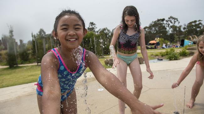 Aria, 7, cools down at Royal Park Nature Play. Picture: Christopher Chan