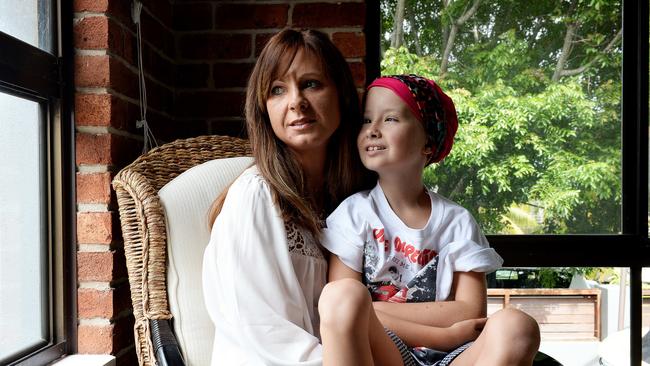 Eight-year-old Charlie Carr with mum Melissa at home in Newcastle. Picture by Peter Lorimer