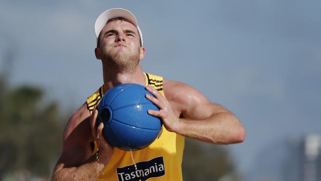 Tom Mitchell working hard at Hawthorns pre-season training session at Mooloolaba Beach. Photo Lachie Millard