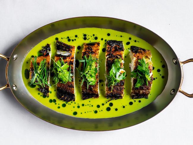Coal-roasted coral trout in green garlic sauce from Eleven Barrack. Picture: Supplied