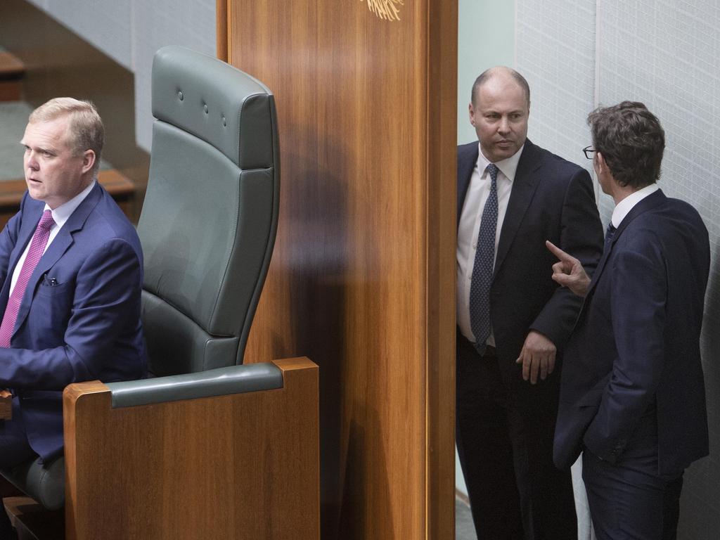 Treasurer Josh Frydenberg and Stephen Jones exchange words behind the speaker’s chair in the House of Representatives. Picture: NCA NewsWire / Gary Ramage