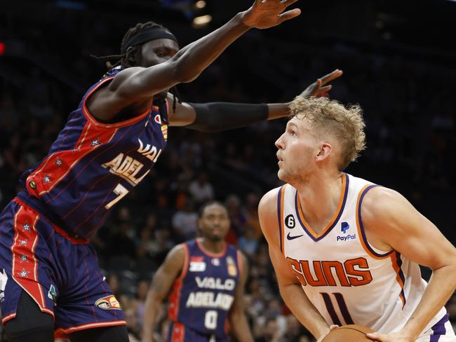 Deng Acuoth Adelaide 36ers defends Aussie Jock Landale. Picture: AFP