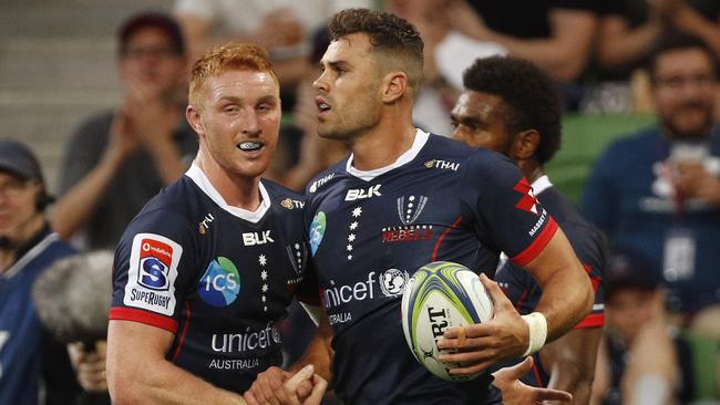 Tom English of the Rebels (right) celebrates a try with teammate Brad Wilkin. Picture: AAP