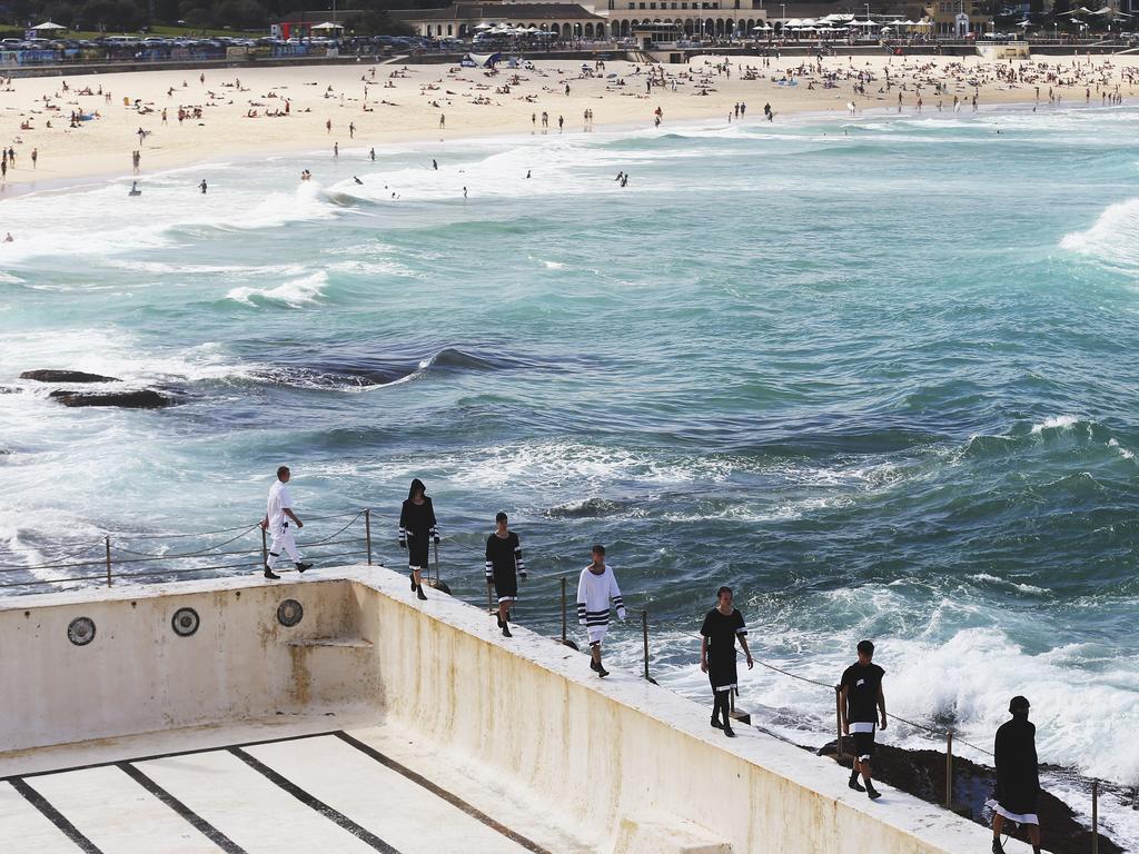 Models showcase designs during the Ten Pieces show at Mercedes-Benz Fashion Week Australia 2015 at Bondi Icebergs. Picture: Getty