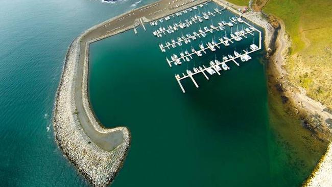 WIND IN THE RIGGING: An aerial view of the Wirrina Cove marina where berth owners are taking legal action.