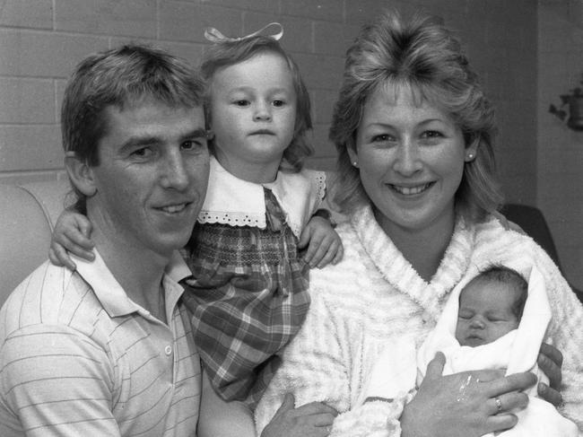 Dean Holland as a newborn baby with his mum Belinda, sister Kirstie and dad Darren.