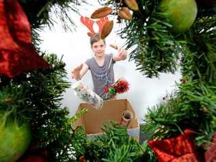 Ainslee Hunter box's up some christmas gear on boxing day Photo: Blainey Woodham / Daily News. Picture: Blainey Woodham