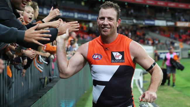 Steve Johnson celebrates the win over Collingwood with fans at Spotless Stadium. Picture: Phil Hillyard