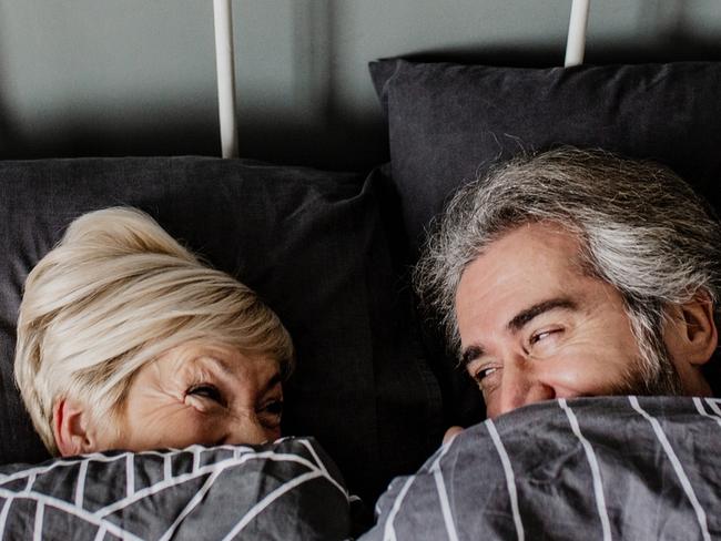 Portrait of senior couple in bed