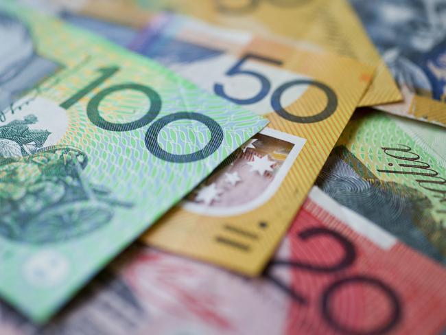 Australian money background showing $100, $50 and $20 notes with a shallow depth of field.