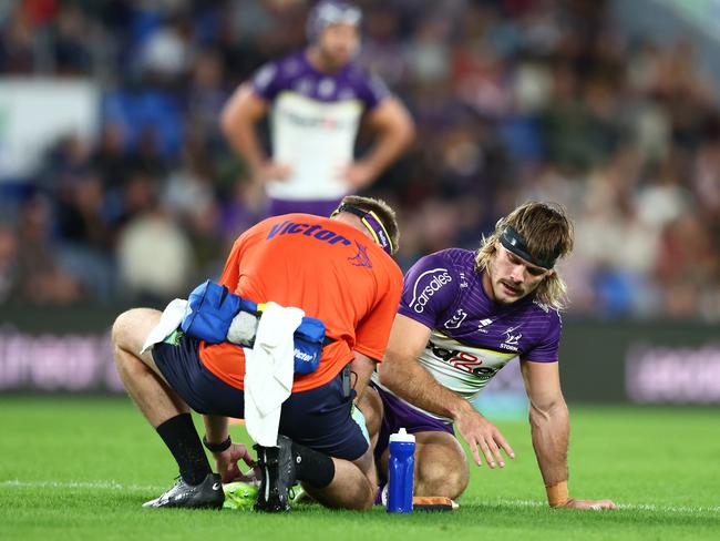 Ryan Papenhuyzen is treated for his injury. Picture: Chris Hyde/Getty Images