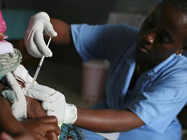 A child is vaccinated against malaria in Tanzania AP Photo/Darby Communications, John-Michael Maas