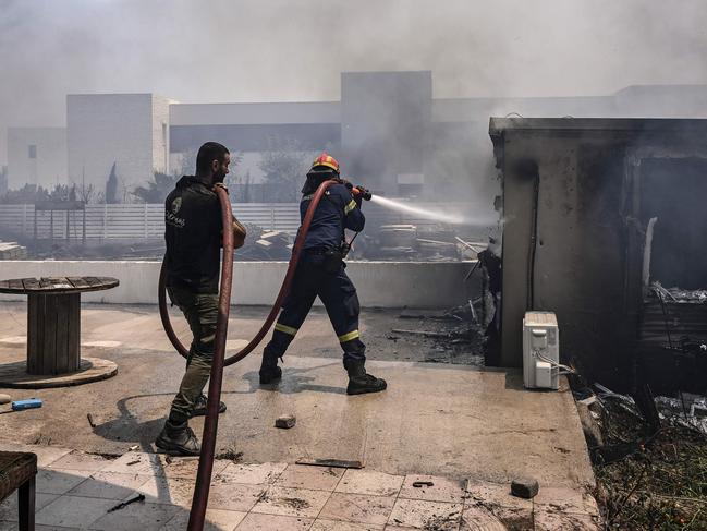 Firefighters tackled blazes that erupted in peak tourism season, sparking Greece’s largest-ever wildfire evacuation. Picture: AFP