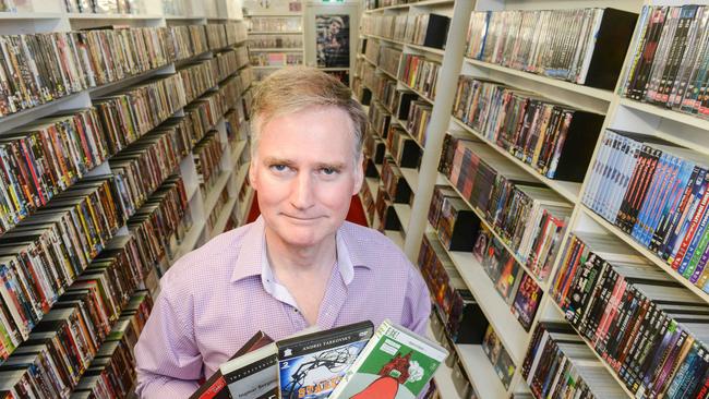 Galactic Video owner Stephen Zivkovic with some of his rare titles. Picture: Brenton Edwards