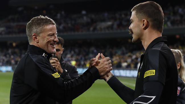 Damien Hardwick celebrates with Oleg Markov after Friday night’s heartstopping victory. Picture: Ryan Pierse/Getty Images