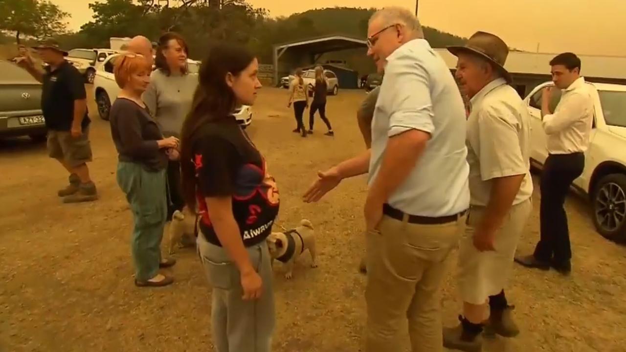 A woman angrily confronts Australian Prime Minister Scott Morrison in the township of Cobargo. Picture: Supplied