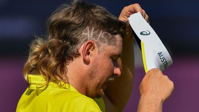 Australia's Cameron Smith, with the letters AUS shaved into his hair, during round 4. Picture: Kazuhiro Nogi/AFP