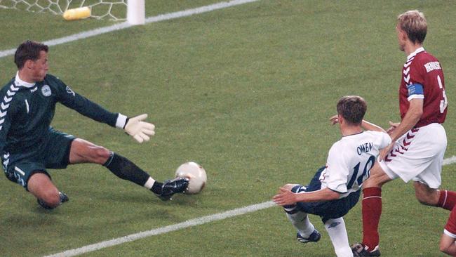 Danish goalkeeper Thomas Sorensen tries in vain to stop a strike from England’s Michael Owen during the 2002 World Cup finals.