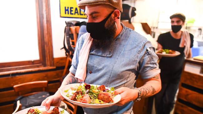 Chefs prepare meals for testing during a staff orientation day as Tiamo Bistro readies for opening in Melbourne on October 27, 2020. Picture: William WEST / AFP