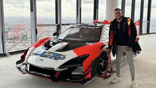 Adrian Portelli with his $3m McLaren after it was craned into his Melbourne penthouse. Picture: Supplied