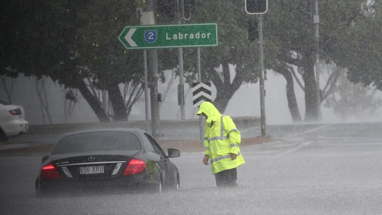 A car is flooded on Queen St in Southport after a storm lashes the Gold Coast. Photograph : Jason O’Brien