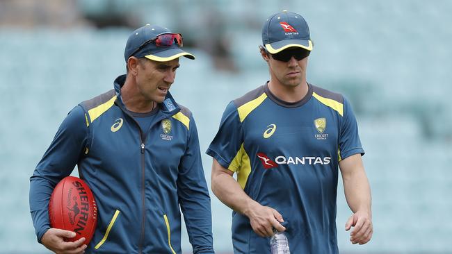 Australian coach Justin Langer speaks with Travis Head during a net session ahead of the next Ashes Test at The Oval. Picture: Ryan Pierse/Getty Images