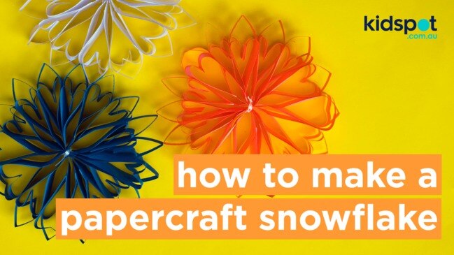 Make a papercraft snowflake using paper, that you can use to decorate the tree, or hang around your home.