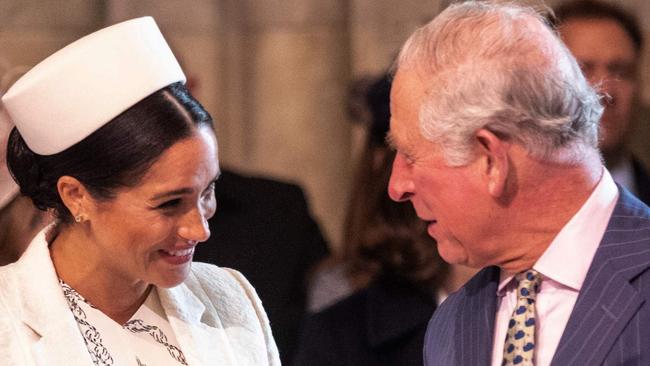 Britain's Meghan, Duchess of Sussex (L) talks with Britain's Prince Charles, Prince of Wales (R) as they attend the Commonwealth Day service at Westminster Abbey in London on March 11, 2019. - Britain's Queen Elizabeth II has been the Head of the Commonwealth throughout her reign. Organised by the Royal Commonwealth Society, the Service is the largest annual inter-faith gathering in the United Kingdom. (Photo by Richard Pohle / POOL / AFP)