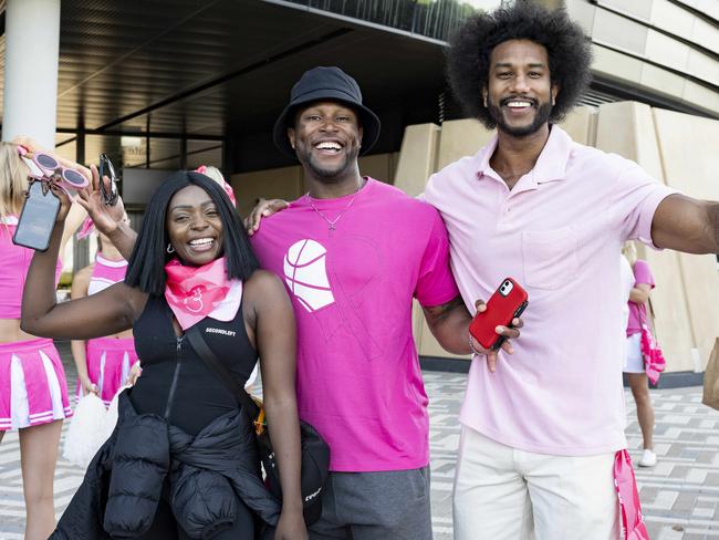 Suzan Mutesi, Cory ”Sauce” Brown and Yannick Samarasinghe at the Pink Parade in front of the SCG. Picture: Monique Harmer