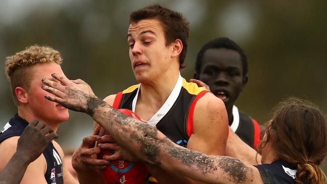 Dandenong Stingrays’ Matthew Gahan gets wrapped up during his side’s clash with Geelong Falcons. Picture: Kelly Defina.