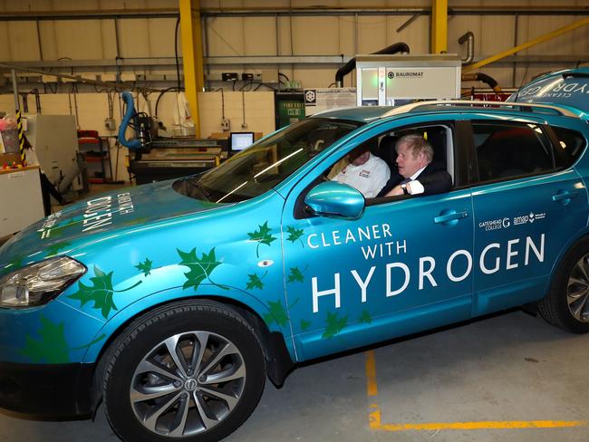 Britain's Prime Minister Boris Johnson sits in a hydrogen-fuelled prototype car. The UK recently announced plans to ban the sale of petrol, diesel and hybrid cars from 2035 – leaving the market to just electric and hydrogen-powered vehicles. Picture: Scott Heppell/AFP