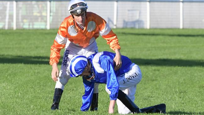 Race 8 — 3:55PM SCHWEPPES SYDNEY CUP (3200 METRES). James Doyle falls from 'Almoonqith' and collided with 'Who Shot The Barman' ridden by Blake Shinn.