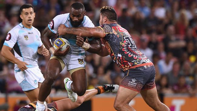 BRISBANE, AUSTRALIA - FEBRUARY 13: Semi Radradra of the World All Stars takes on the defence during the NRL match between the Indigenous All-Stars and the World All-Stars at Suncorp Stadium on February 13, 2016 in Brisbane, Australia. (Photo by Matt Roberts/Getty Images)