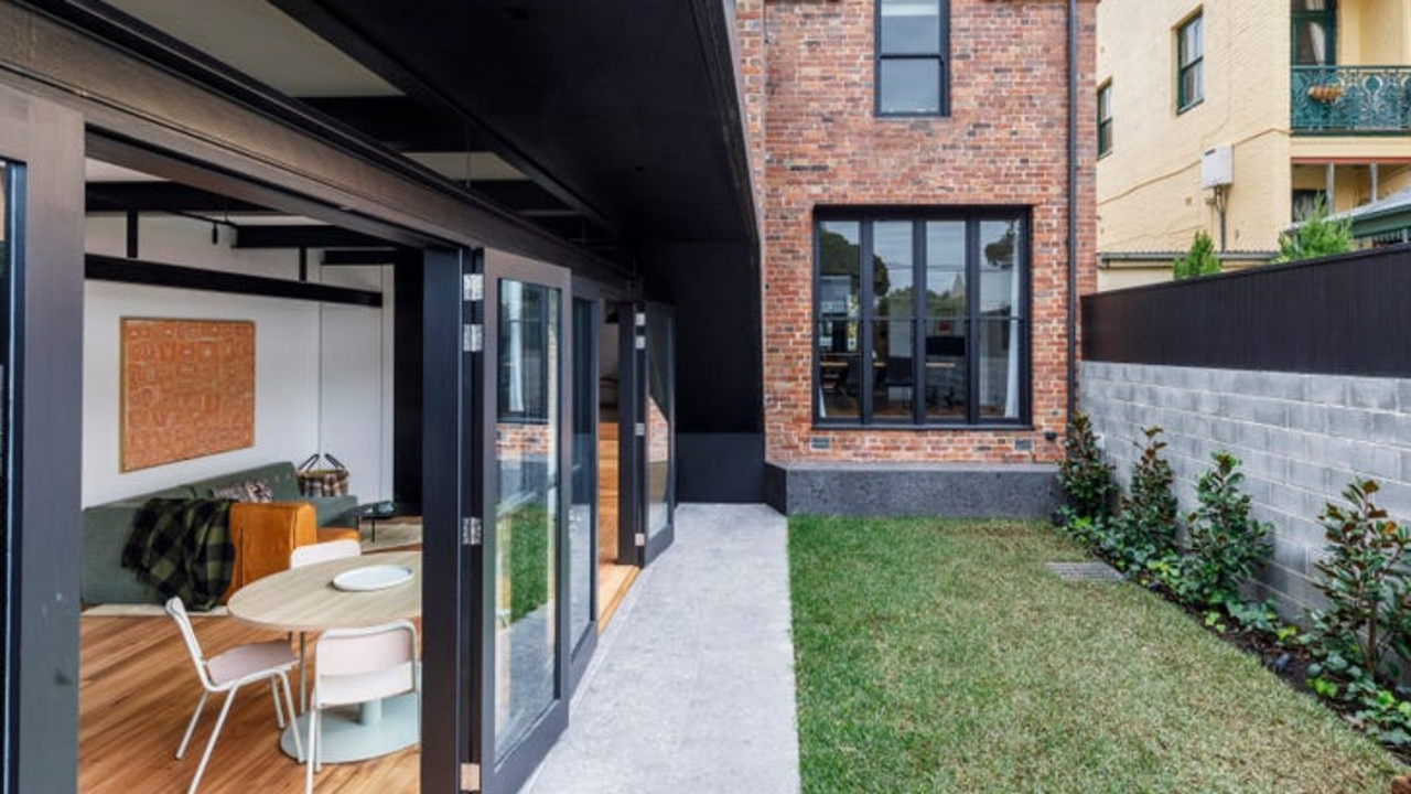 The backyard leads into the kitchen and a sitting area. Picture: realestate.com.au