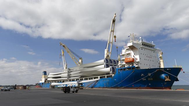 Wind turbine blades are offloaded from a Chinese cargo ship at GeelongPort earlier this year. Picture: Alan Barber