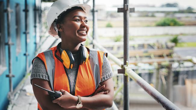 Shot of a young woman working at a construction site