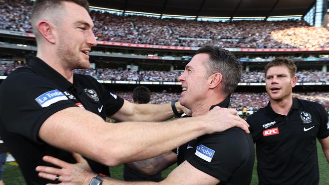 MELBOURNE , AUSTRALIA. September 30, 2023. AFL Grand Final between Collingwood and the Brisbane Lions at the MCG.  Craig Macrae, senior coach of the Magpies with Daniel McStay and Taylor Adams   .Picture by Michael Klein