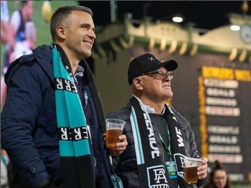 Premier Peter Malinauskas, pictured with his father, laughed during a press conference after he was questioned about Friday night's AFL Showdown. Picture: Instagram