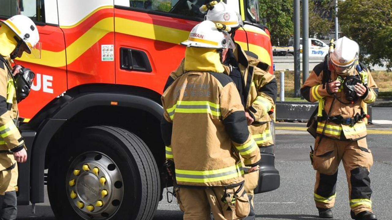 Firecrews extinguished a blaze at a Burnett Heads property after a woman was rushed to hospital on Tuesday morning.